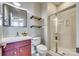 Cozy bathroom featuring a glass shower, marble countertop, and two floating shelves on the wall at 663 Sixth Baxter Xing, Fort Mill, SC 29708