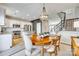 Inviting dining area open to the kitchen, featuring a chandelier and wood table, perfect for entertaining at 663 Sixth Baxter Xing, Fort Mill, SC 29708