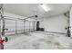 Spacious two car garage with concrete floors and white walls, ready for parking and storage at 663 Sixth Baxter Xing, Fort Mill, SC 29708