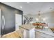 Open-concept kitchen island transitions into dining area and staircase, great for entertaining and Gathering at 663 Sixth Baxter Xing, Fort Mill, SC 29708