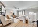 Bright living room with hardwood floors, a fireplace, and neutral furnishings, creating a welcoming space at 663 Sixth Baxter Xing, Fort Mill, SC 29708