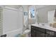 Bright bathroom featuring a tub/shower combination, vanity with solid surface tops, and modern fixtures at 664 Bluff Loop Rd # 202, Rock Hill, SC 29730