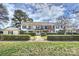 Charming two-story exterior showcasing manicured lawn, mature trees, and inviting facade at 7101 Quail Meadow Ln, Charlotte, NC 28210