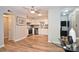 Contemporary kitchen featuring stainless steel appliances, wood flooring, and a modern aesthetic at 7101 Quail Meadow Ln, Charlotte, NC 28210