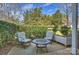 Outdoor patio area with comfortable seating and serene landscaping, perfect for relaxation at 7101 Quail Meadow Ln, Charlotte, NC 28210