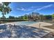 Closed community pool surrounded by a paved deck area, lush greenery and a clear sky at 7101 Quail Meadow Ln, Charlotte, NC 28210