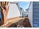 Backyard view featuring a shed with a concrete patio and landscaping around the perimeter at 723 W Zion Church Rd, Shelby, NC 28150