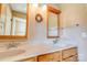 Bright bathroom featuring double sinks, framed mirrors, and neutral countertops, creating a serene space at 723 W Zion Church Rd, Shelby, NC 28150