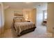 Cozy bedroom with a patterned bedspread, decorative wall art, and warm, neutral paint at 723 W Zion Church Rd, Shelby, NC 28150