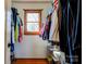 Walk-in closet with wood floors, filled with clothing, features a window with natural light at 723 W Zion Church Rd, Shelby, NC 28150