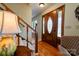 Elegant entryway showcasing a beautiful wooden front door and staircase, creating a warm and inviting first impression at 723 W Zion Church Rd, Shelby, NC 28150