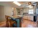 Open-concept kitchen featuring a center island with bar stools, stainless steel appliances, and ample cabinet space at 723 W Zion Church Rd, Shelby, NC 28150