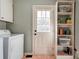 A laundry room featuring a washer and door to the backyard at 723 W Zion Church Rd, Shelby, NC 28150