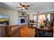 Bright living room featuring hardwood floors, a fireplace, and ample natural light at 723 W Zion Church Rd, Shelby, NC 28150