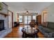 A living room featuring a fireplace, hardwood floors, and a ceiling fan at 723 W Zion Church Rd, Shelby, NC 28150