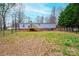 Spacious fenced backyard with a lawn and a wooden deck, perfect for outdoor entertaining at 80 Sunset Dr, Taylorsville, NC 28681