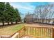 A nice fenced backyard viewed from a wooden porch at 80 Sunset Dr, Taylorsville, NC 28681