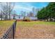 Backyard featuring a full-length porch, lawn, and a chain-link fence at 80 Sunset Dr, Taylorsville, NC 28681