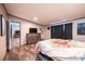 This stylish main bedroom features wood-look floors and a flatscreen TV at 80 Sunset Dr, Taylorsville, NC 28681