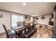 Bright dining room with a wooden table, a bench, and modern decor elements at 80 Sunset Dr, Taylorsville, NC 28681