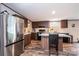 Modern kitchen featuring stainless steel appliances, island with seating, and stylish countertops at 80 Sunset Dr, Taylorsville, NC 28681