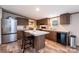 Modern kitchen with stainless steel appliances, an island, and dark wood cabinetry at 80 Sunset Dr, Taylorsville, NC 28681