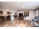 Open-concept living area with wood-look floors flowing into the dining and kitchen areas at 80 Sunset Dr, Taylorsville, NC 28681