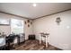 Functional home office space featuring wood floors, a desk, and natural light at 80 Sunset Dr, Taylorsville, NC 28681