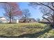 Expansive backyard with a white shed, deck, and plenty of room for enjoying outdoor living at 8009 Idlewild Rd, Indian Trail, NC 28079