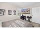 Comfortable bedroom featuring neutral paint, wood-look floors and a tv at 8009 Idlewild Rd, Indian Trail, NC 28079