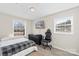 Comfortable bedroom featuring neutral paint, wood-look floors and a tv at 8009 Idlewild Rd, Indian Trail, NC 28079