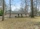 Back of house with large yard at 8101 Coxwood Ct, Charlotte, NC 28227