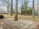 An expansive backyard is paved at 8101 Coxwood Ct, Charlotte, NC 28227