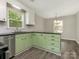 Well-lit kitchen boasts ample counter space and modern appliances for cooking ease at 8101 Coxwood Ct, Charlotte, NC 28227