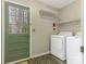 Functional laundry room with modern appliances and access to the outdoors at 8101 Coxwood Ct, Charlotte, NC 28227