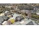 An aerial view showcases townhouses with gray roofs, surrounded by lush landscaping and a nearby parking area at 8328 Highland Glen Dr, Charlotte, NC 28269