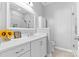 Bright bathroom featuring white cabinets, modern sink, and a glass door shower providing a fresh, clean feel at 8328 Highland Glen Dr, Charlotte, NC 28269