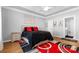 Bright bedroom featuring wood floors, a large bed, and ample natural light for a restful and inviting space at 8328 Highland Glen Dr, Charlotte, NC 28269