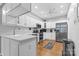 Well-lit kitchen with white cabinets, stainless steel appliances, and a functional design at 8328 Highland Glen Dr, Charlotte, NC 28269