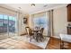 Cozy breakfast nook with wooden table and chairs, adjacent to a sunny outdoor patio at 8436 Summerford Dr, Charlotte, NC 28269