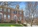 Brick townhome features a well-maintained lawn and shrubbery leading to the front entrance at 8436 Summerford Dr, Charlotte, NC 28269