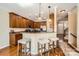 Kitchen features wooden cabinets, granite countertops, stainless appliances and breakfast bar with stools at 8436 Summerford Dr, Charlotte, NC 28269