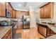 Kitchen with wooden cabinets, granite countertops, stainless steel appliances and hardwood floors at 8436 Summerford Dr, Charlotte, NC 28269