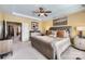 Bright main bedroom featuring a king bed, dresser, and soft carpet, creating a comfortable retreat at 8436 Summerford Dr, Charlotte, NC 28269