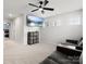 Bonus room with a ceiling fan and flat-screen television at 925 Deep River Way, Waxhaw, NC 28173