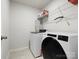 Laundry room with modern appliances and storage shelf at 925 Deep River Way, Waxhaw, NC 28173