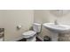 Cozy half bathroom features a pedestal sink and a toilet at 966 Parkland Nw Pl, Concord, NC 28027