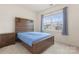 Bedroom featuring a bed and nightstand with a large window that lets in ample natural light at 966 Parkland Nw Pl, Concord, NC 28027