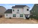 Exterior of the back of the house with a covered patio and fenced in yard at 966 Parkland Nw Pl, Concord, NC 28027