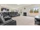 Open-concept area with neutral carpet, recessed lights, a fireplace, and large windows at 966 Parkland Nw Pl, Concord, NC 28027